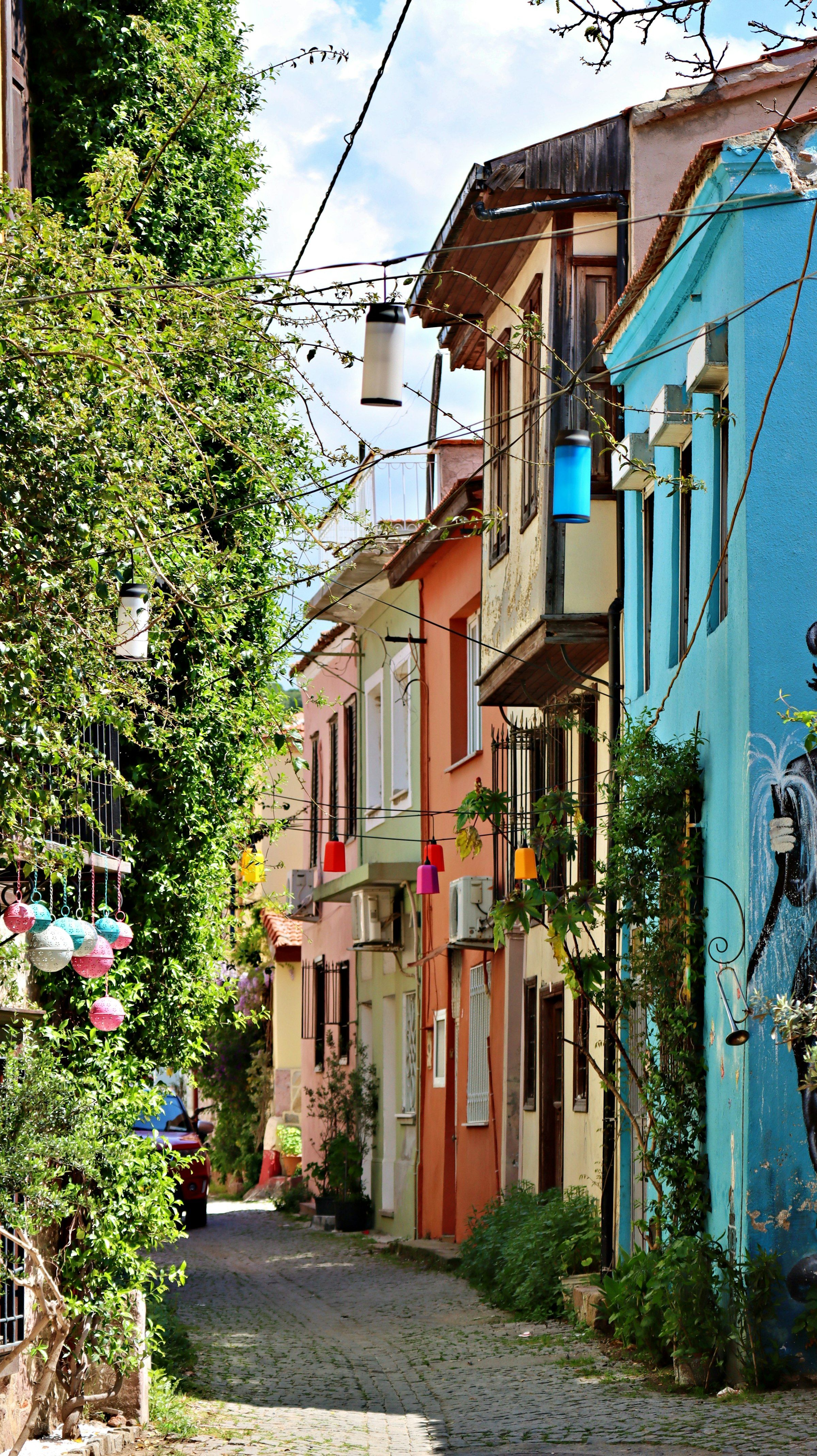 A cobbled street of colourful old houses