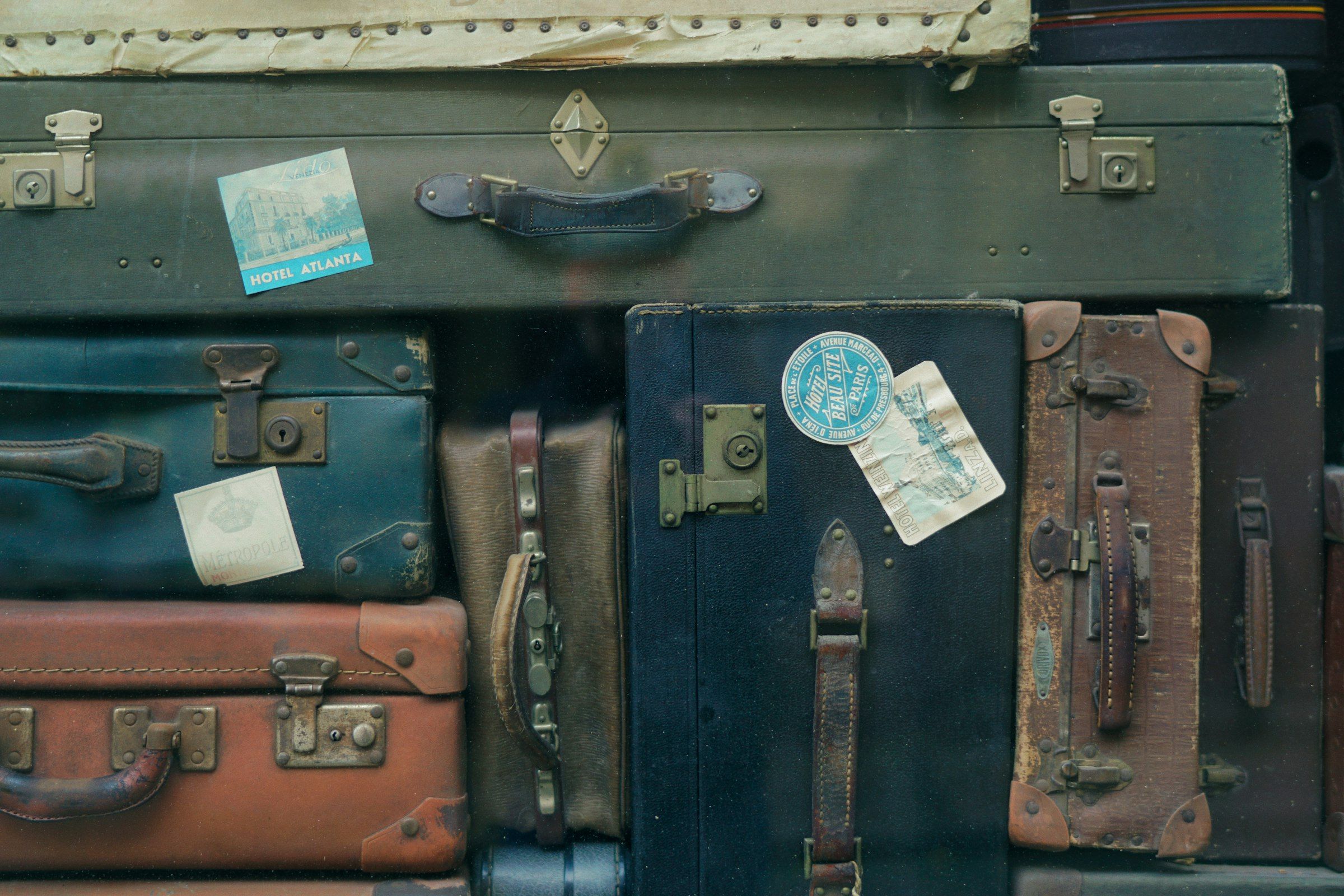A stack of colourful vintage suitcases
