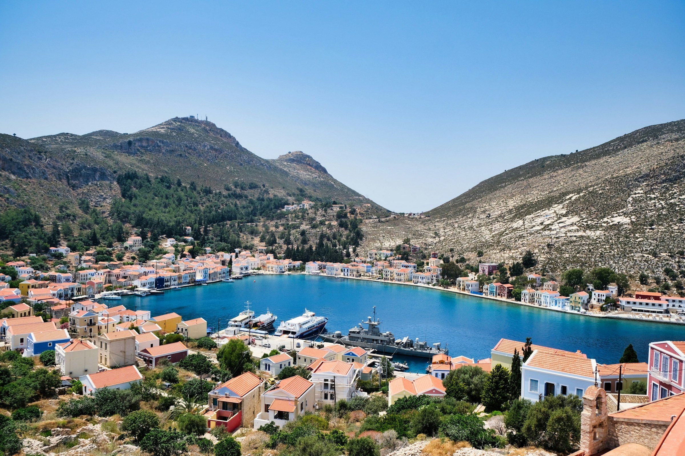 A small harbour ringed by colourful houses