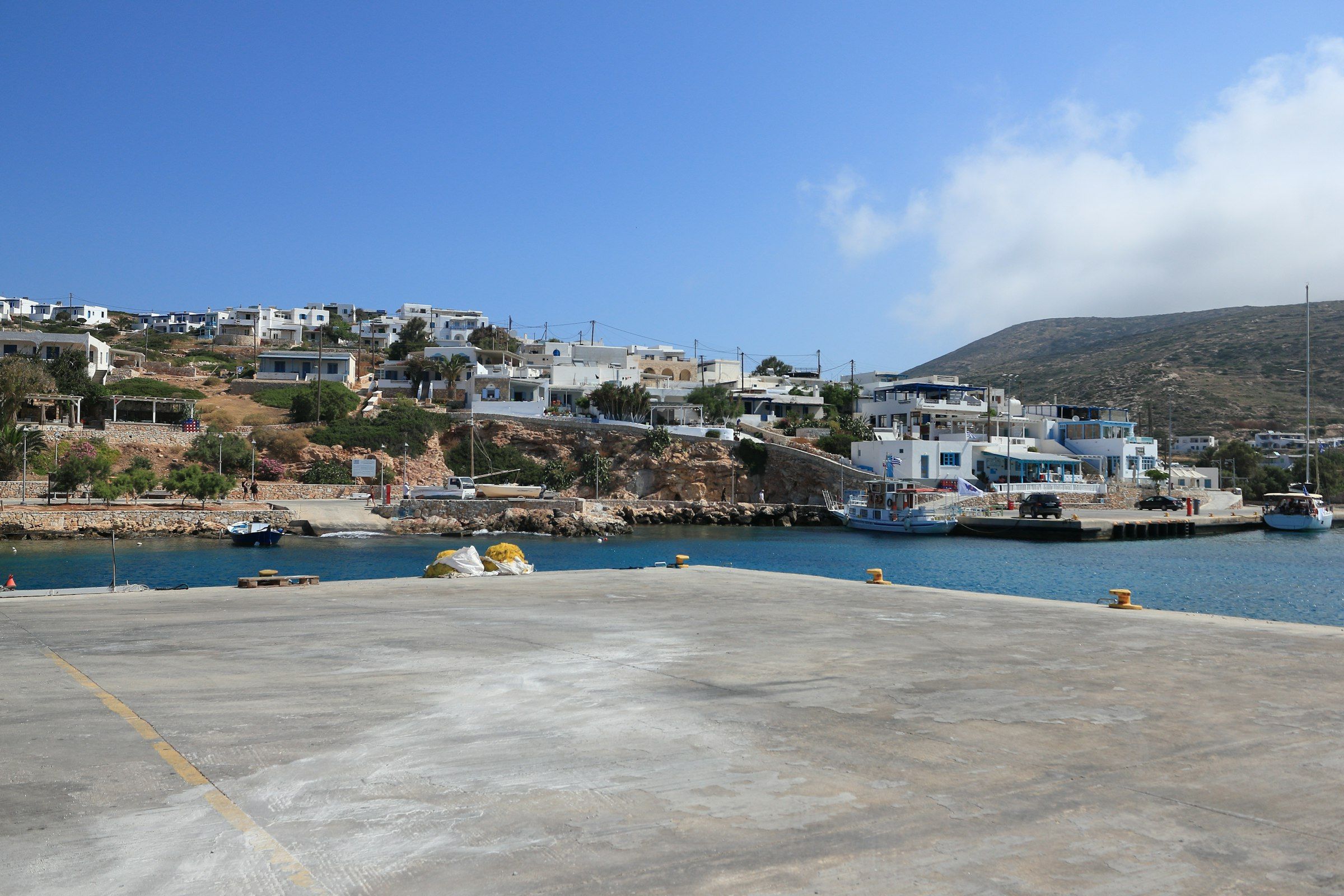 Island harbour with white buildings and blue water