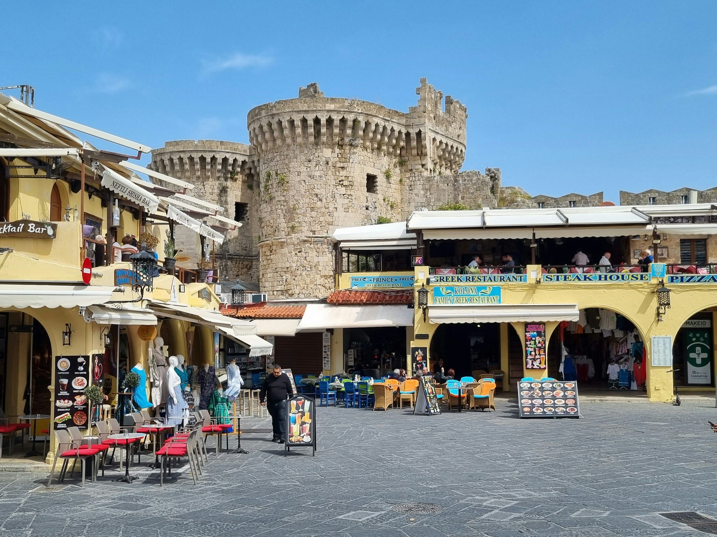 Medieval towers and cafés in Rhodes old town